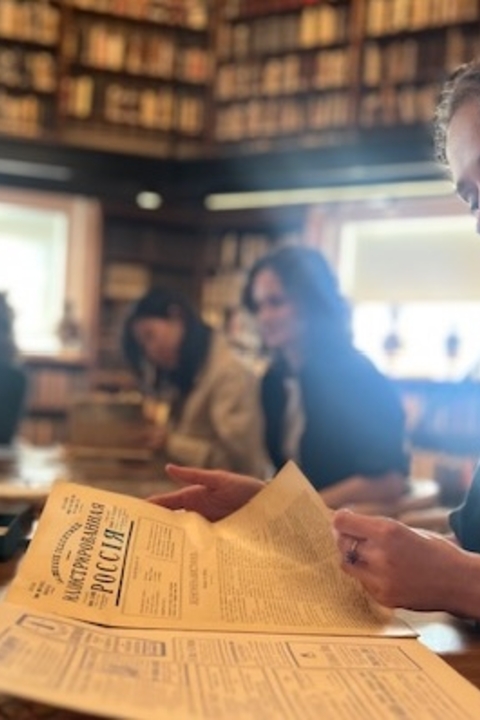 Female student reading a newspaper