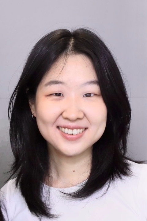 Headshot of Yoonmin against a blank background.